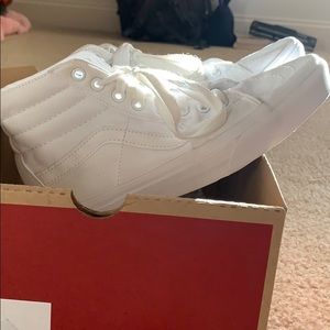 White high top Vans.